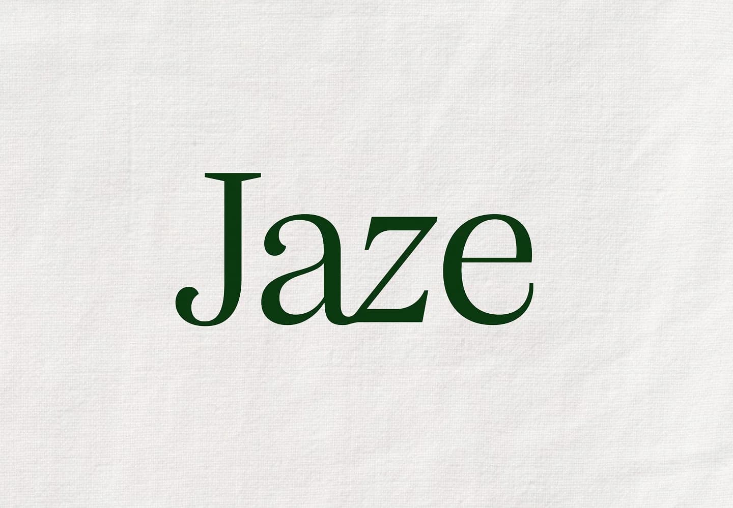 Logotipo verde de Jaze sobre una textura de lino blanco