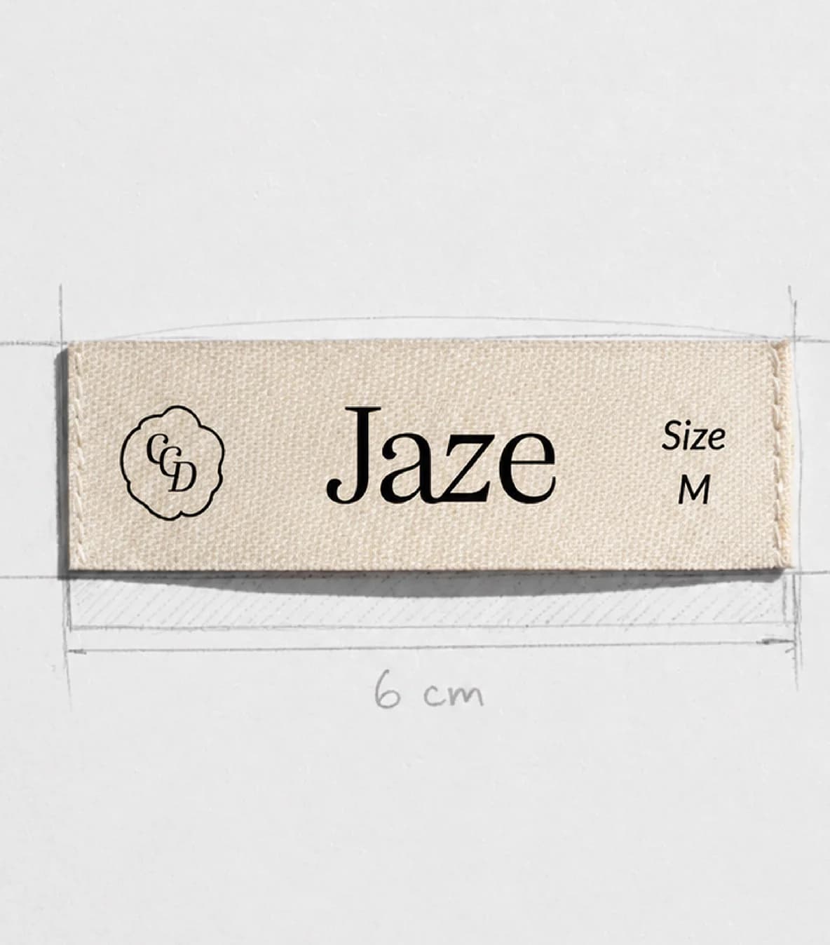 Etiqueta textil crema de la marca de ropa Jaze